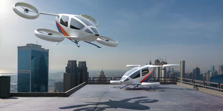 An eVTOL In Mid Air About to Take Off / Land Above a SkyScraper Roof