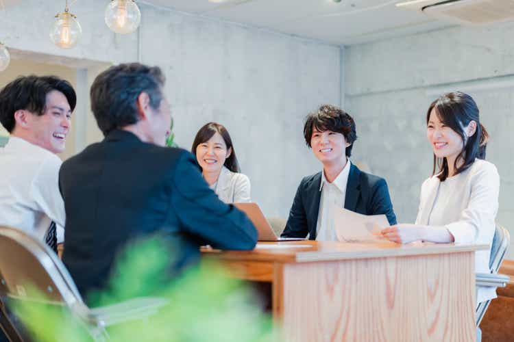 Businessman in a meeting with a smile
