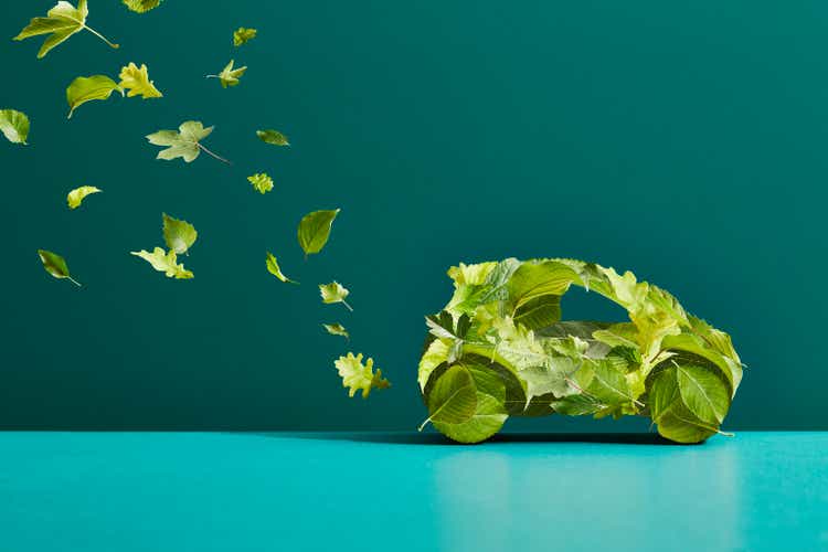A car made of leaves with an exhaust trail of leaves