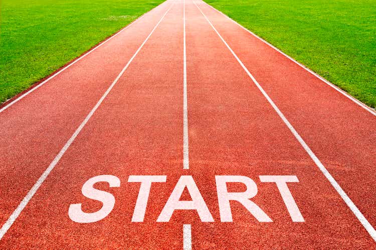 Start written on starting line on of running track of sports field