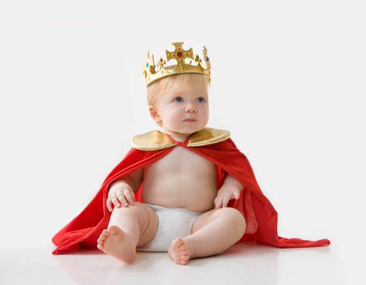 Caucasian baby boy dressed as king