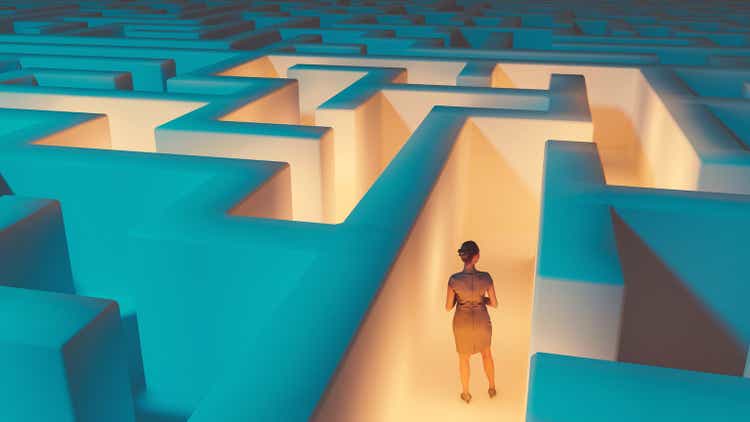 Woman looking for at way to escape maze