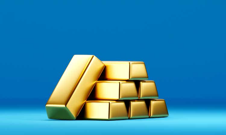 Golden dollar coins fall out the open safe boxPile or stack of gold bars