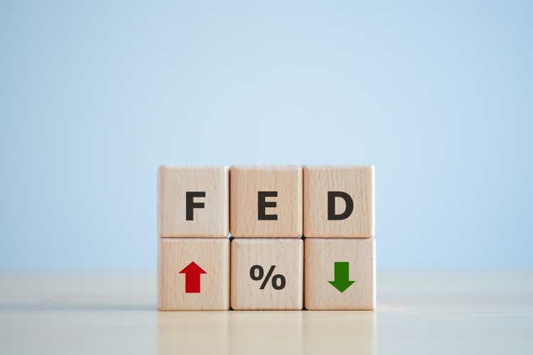 FED, federal reserve, Control interest rates, Inflation, Interest rates. World economy crisis, American economy and business concept. FED on Wooden block with Percentage sign and arrow up and down.