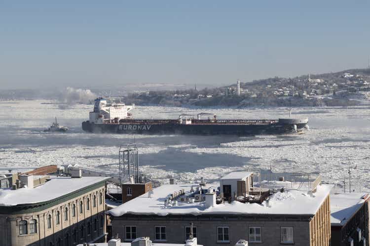 An Euronav cargo ship navigating the St. Lawrence River near Quebec City. The river is frozen.