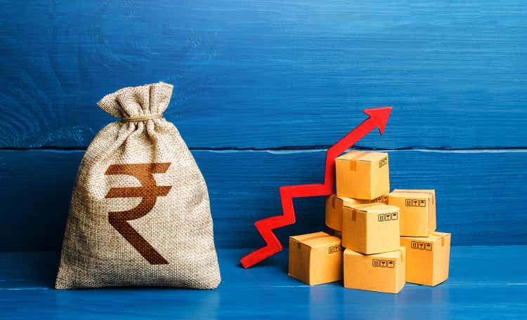 Indian rupee money bag with boxes and up arrow. Income increase, acceleration and growing of economy. Production rise. Growing transportation prices. Good consumer sentiment and demand for goods.