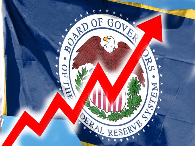 The U.S. Federal Reserve System, with a big red arrow above it. Bar charts and charts. Rising interest rates Rising interest rates, causing food prices to rise. Inflation concept