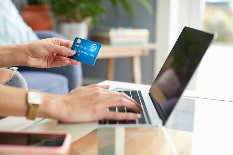 Hands of woman using laptop for online shopping
