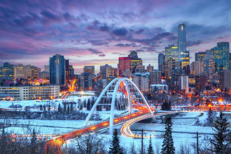 Light trails from rush hour traffic light up Walterdale Bridge in Edmonton, Canada, on a sunset winter night