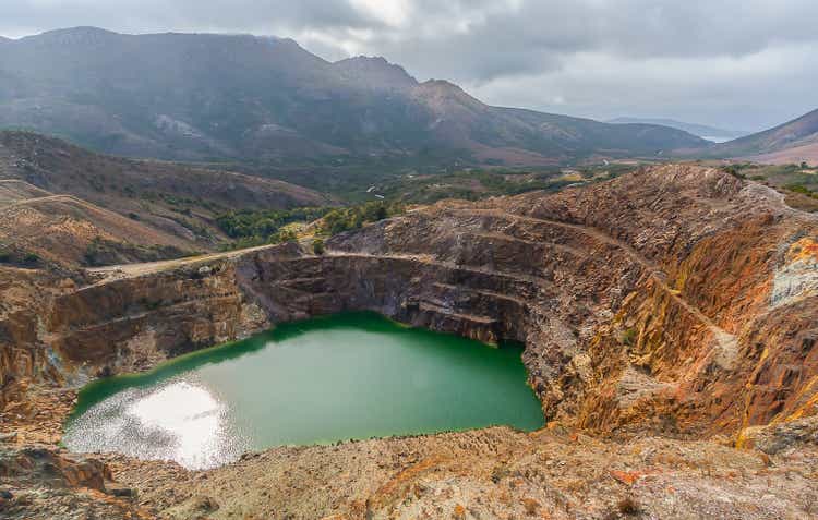Landscape view of Iconic pool of blue-green water former open cut mine at The Iron Blow near Queenstown Tasmania Australia