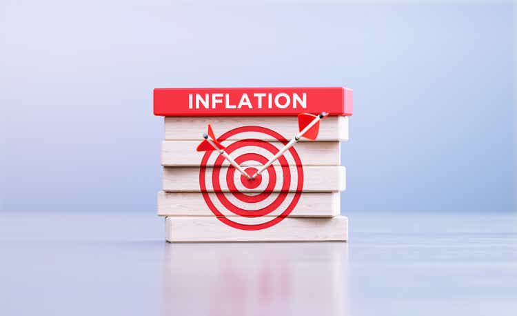 Inflation Concept - Arrows Hitting Bull"s Eye Target Symbol And The Inflation Word Written Wood Blocks In Front Defocused Background