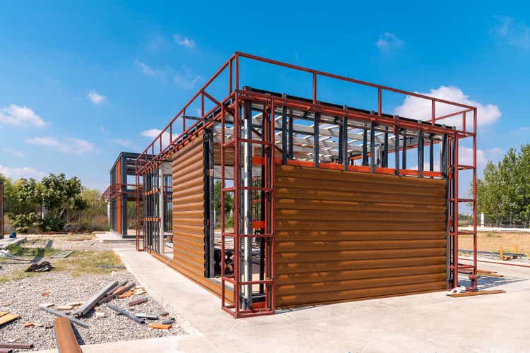 Metal frame of newly built building. Construction of a new tiny house. Selective focus