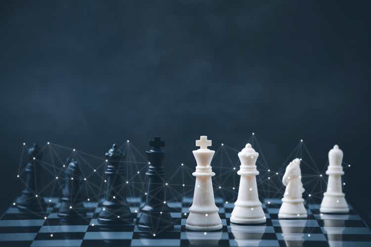 Business strategy competitive ideas concept with chess board game.Business competition, Fighting and confronting problems, threats from surrounding problems. Exhibited under the concept of games.