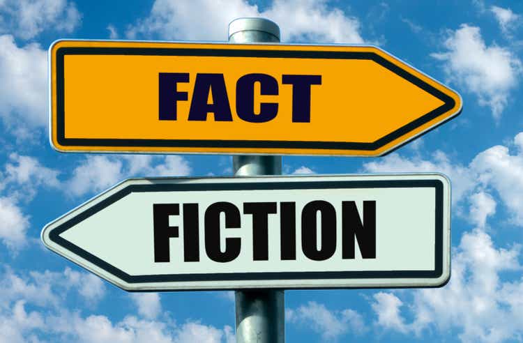 Fact or fiction? two signposts pointing in opposite directions