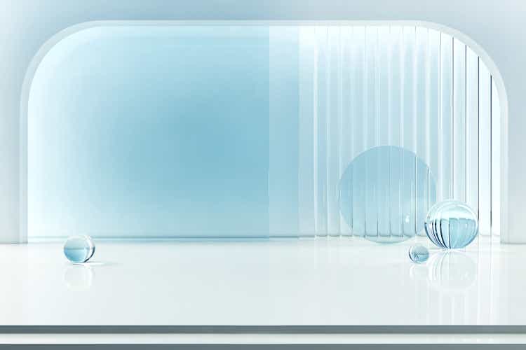 White arch and light blue clear glass backdrop with crystal ball. stage podium clean cool bright. glow light bright product display stand. pedestal for beauty cosmetic or skin care.