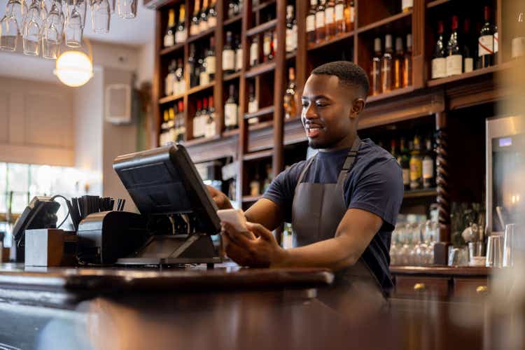 Waiter placing an order in the system using a computer