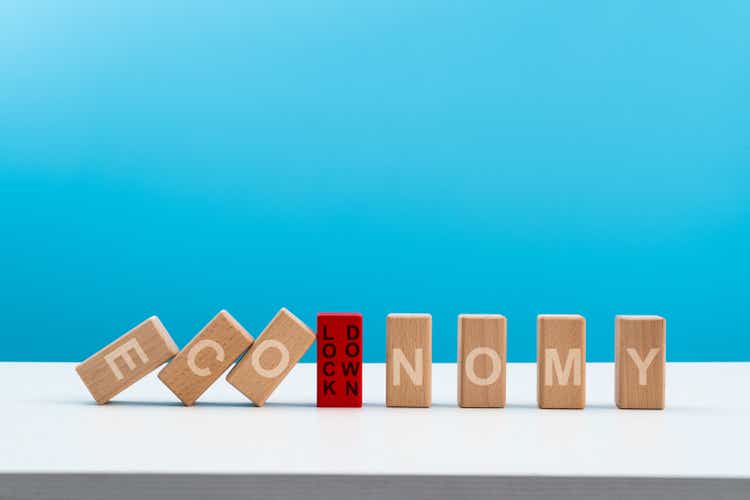 Wooden dominos with word economy