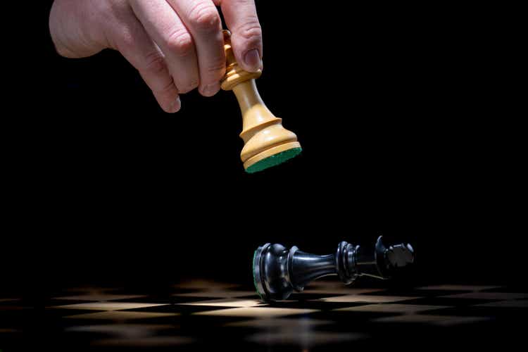 Player moving pieces on chessboard