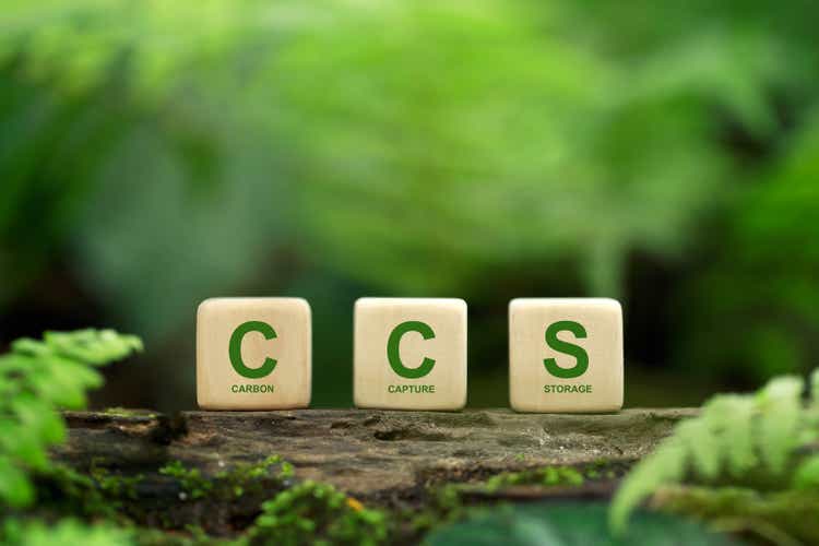 CCS acronym for Carbon Capture Storage words CCS on a wood block on the environmental background. Net zero action concept. Save energy, green energy, reduce carbon footprint, carbon capture.