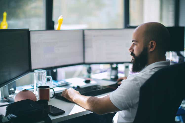 Computer programmer working on new software program.