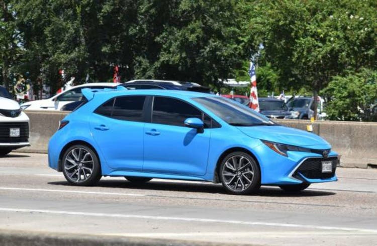 Blue Toyota GR Corolla on Gulf Freeway