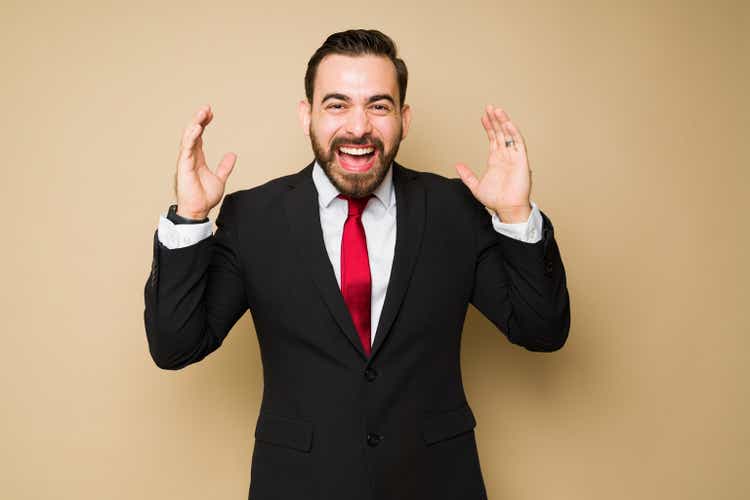 Cheerful investor looking surprised making a good business deal