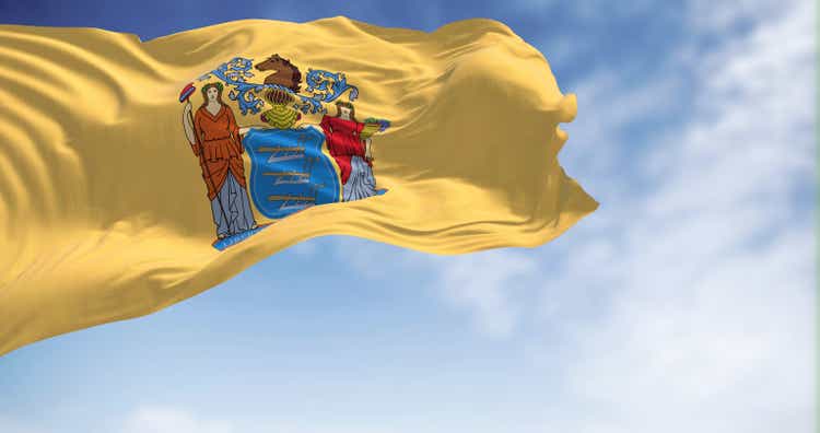Flag of New Jersey state waving in the wind.