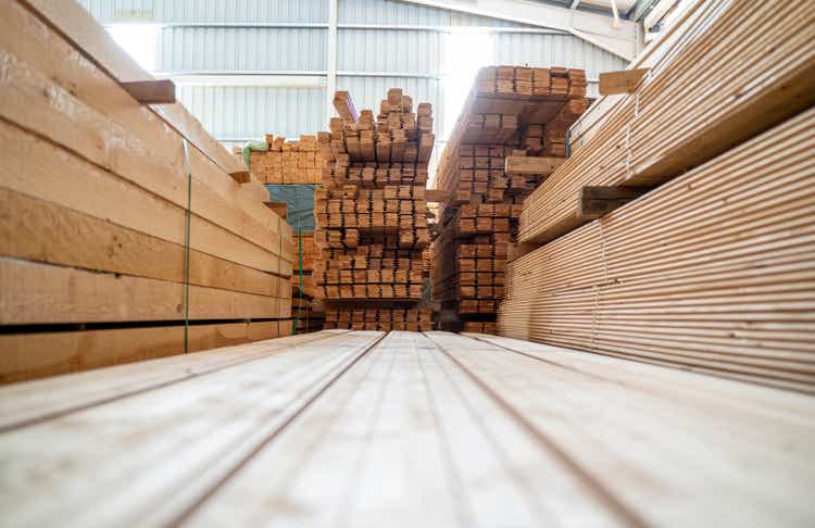 Piles of wood planks in timber yard