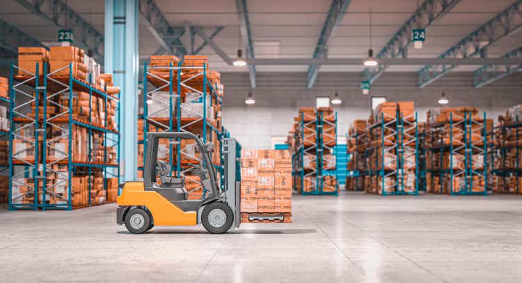 forklift with pallets inside a warehouse.