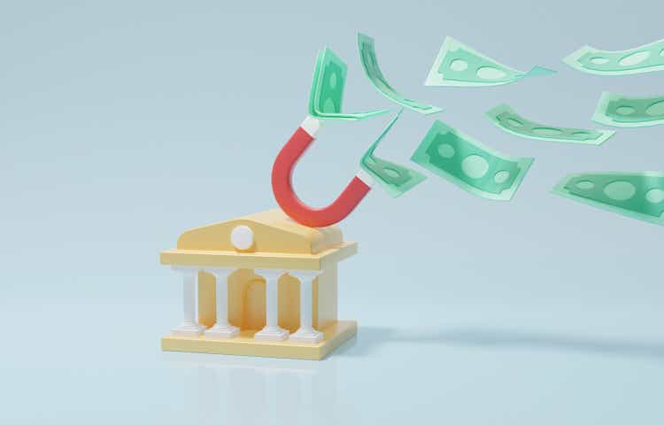 Magnet on bank building attracting banknotes, controlling inflation with a decrease in money supply in economy, central bank or federal reserve policy concept, 3d render illustration.