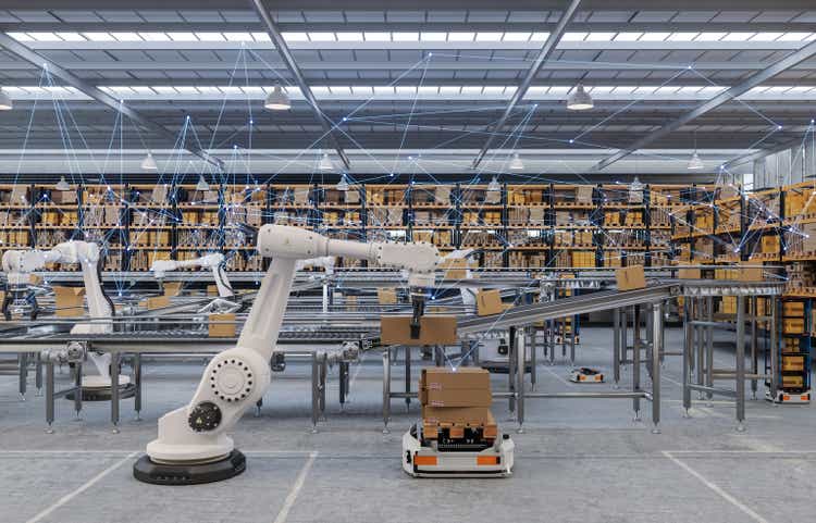 Distribution Warehouse With Plexus, Automated Guided Vehicles And Robots Working On Conveyor Belt