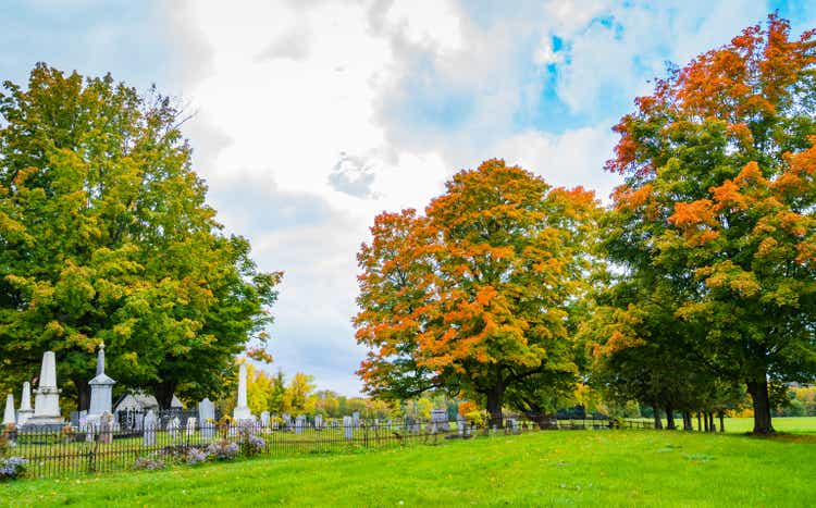 cemetery with bright autumn fall foliage
