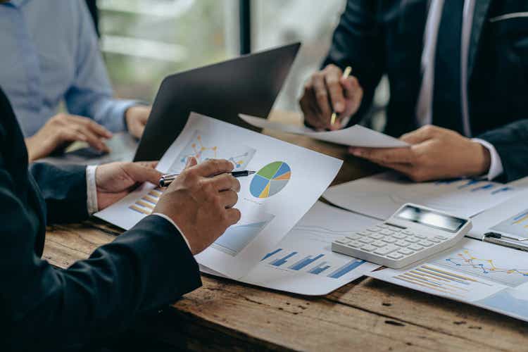 Business team discuss work analysis with graph data, market growth report, presentation and brainstorming on profit strategy planning, financial investment advisor, company accounting ideas.