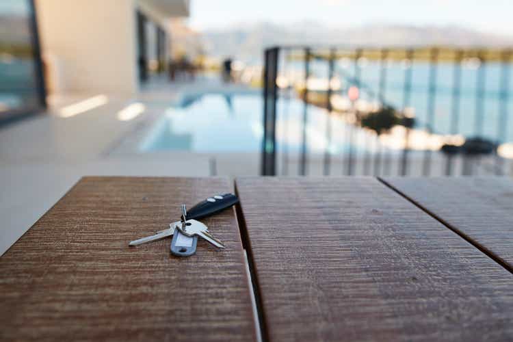 House keys against swimming pool