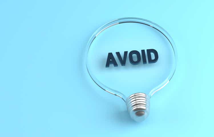 Transparent light bulb on blue background and Avoid message inside
