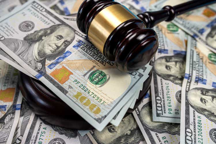 Gavel cash dollar bills and financial crimes.