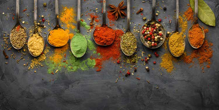 Various seasonings and spices on black stone plate