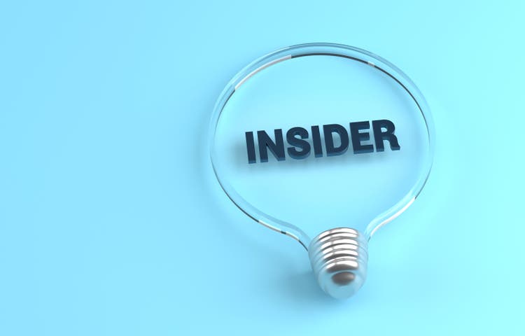 Transparent light bulb on blue background and Insider message inside