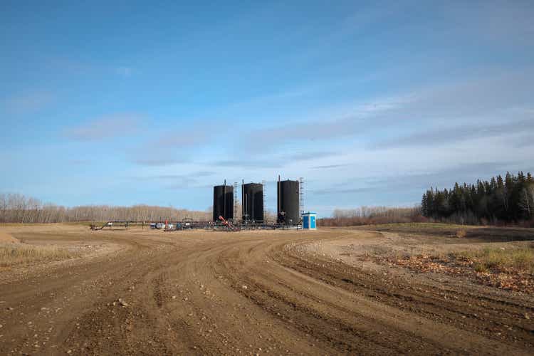 Bitumen oil storage tanks on an oil lease.