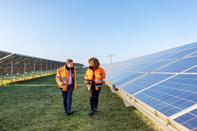 Engineers working at solar power plant