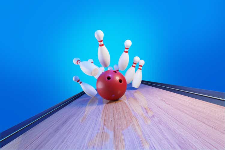 Bowling Concept - Bowling Ball Hitting Pins In The Bowling Alley