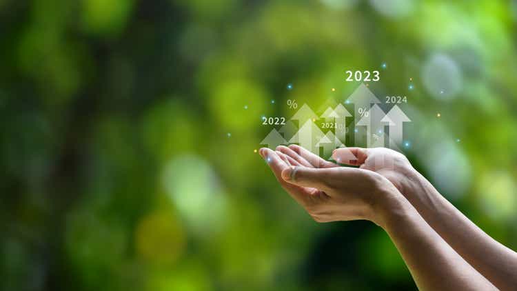 Future planning goals and new visions for the year 2023. Businessman background green environment. with arrow icon increasing future company growth 2023 to 2024 planning opportunities challenges