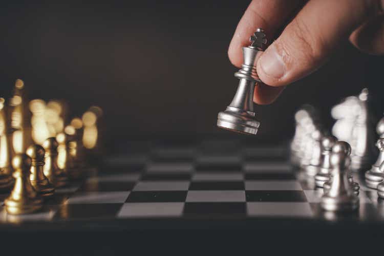 concept Chess pieces are arranged on a chessboard. The beginning of a chess game. Chess as a symbol of leadership, struggle, victory, strategy, business. Retro style.coppy space.