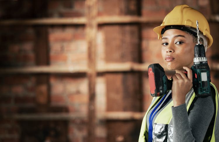 Woman, construction worker or drill tool in property, house or home construction site or innovation, ideas or vision. Portrait, building engineering or electric tool worker in real estate maintenance