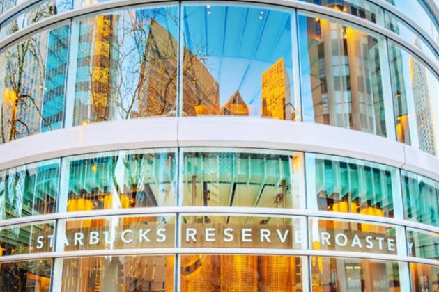 Reflections on the Outside of the Building of Starbucks Reserve on Michigan Avenue, Chicago, Illinois, USA