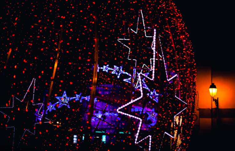 red christmas lights with a star in the background