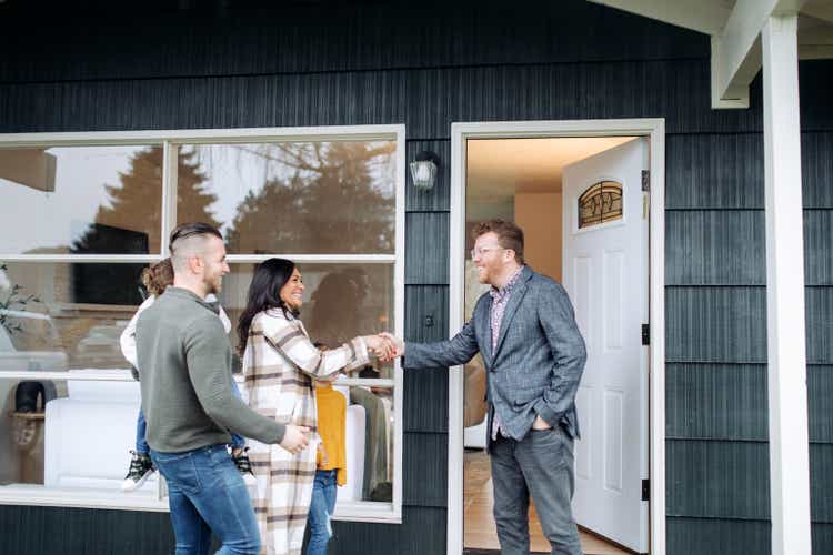 Real Estate Agent Meeting Prospective Buyers