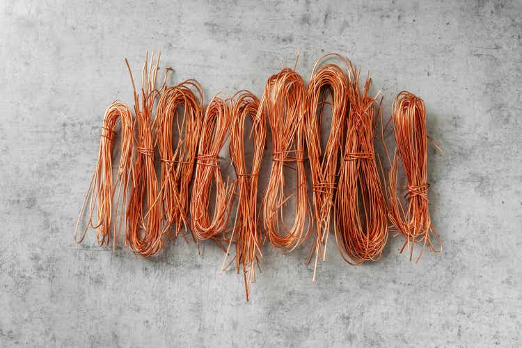 Copper wires twisted on a gray table top view