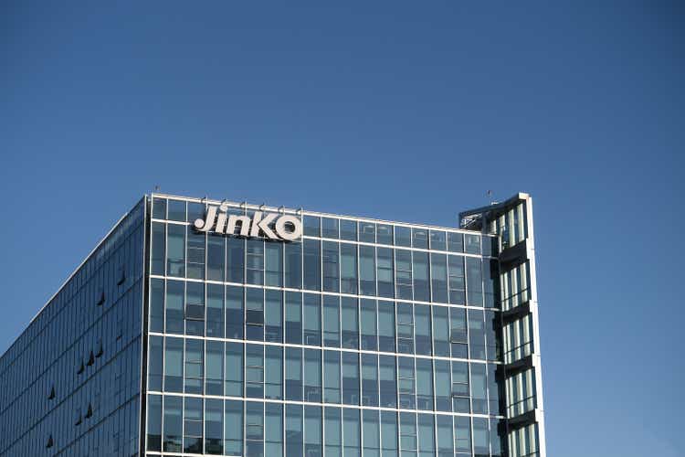 Jinko Solar company headquarters office building with brand logo.