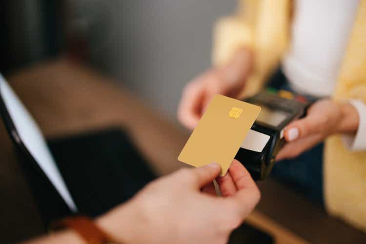 Close Up Photo Of Woman Hands Paying With Credit Card In A Home Decor Store